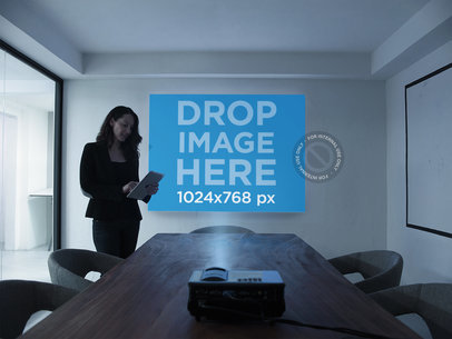 Mockup of a Woman Preparing a Presentation in a Meetings Room a16298