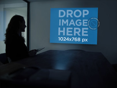 Woman Watching a Presentation Mockup in the Dark a16300