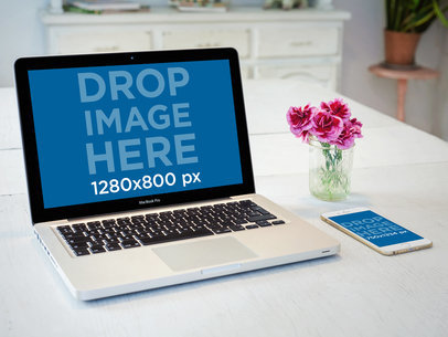 Mockup of an iPhone 6 Lying Next to a Macbook Pro on a Wooden Table a5532b